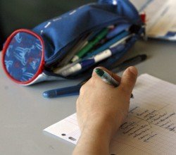 A schoolboy studies during a morning class in a primary classroom at la Providence school in Vincennes